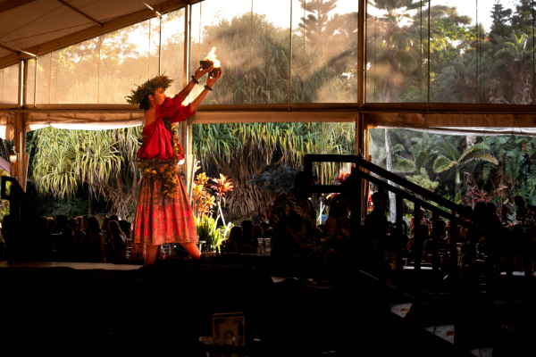 Luau in Kauai woman holding fire on stage