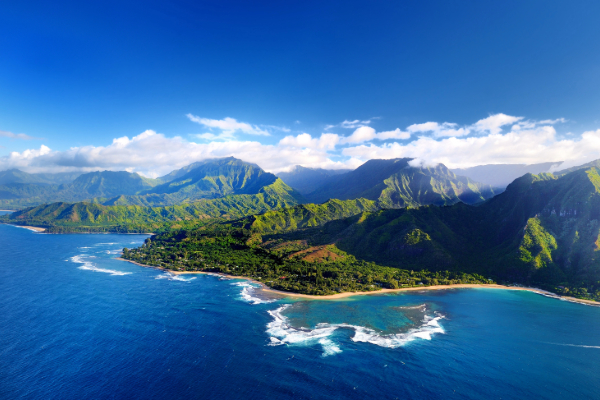 Birds eye view of Kauai with mountains and ocean 