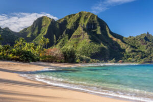 view of tunnels beach in kauai with mountains in the background