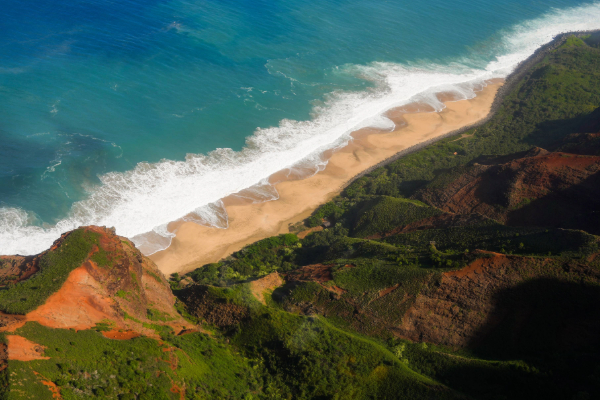 aerial view of kauai with mountains and water